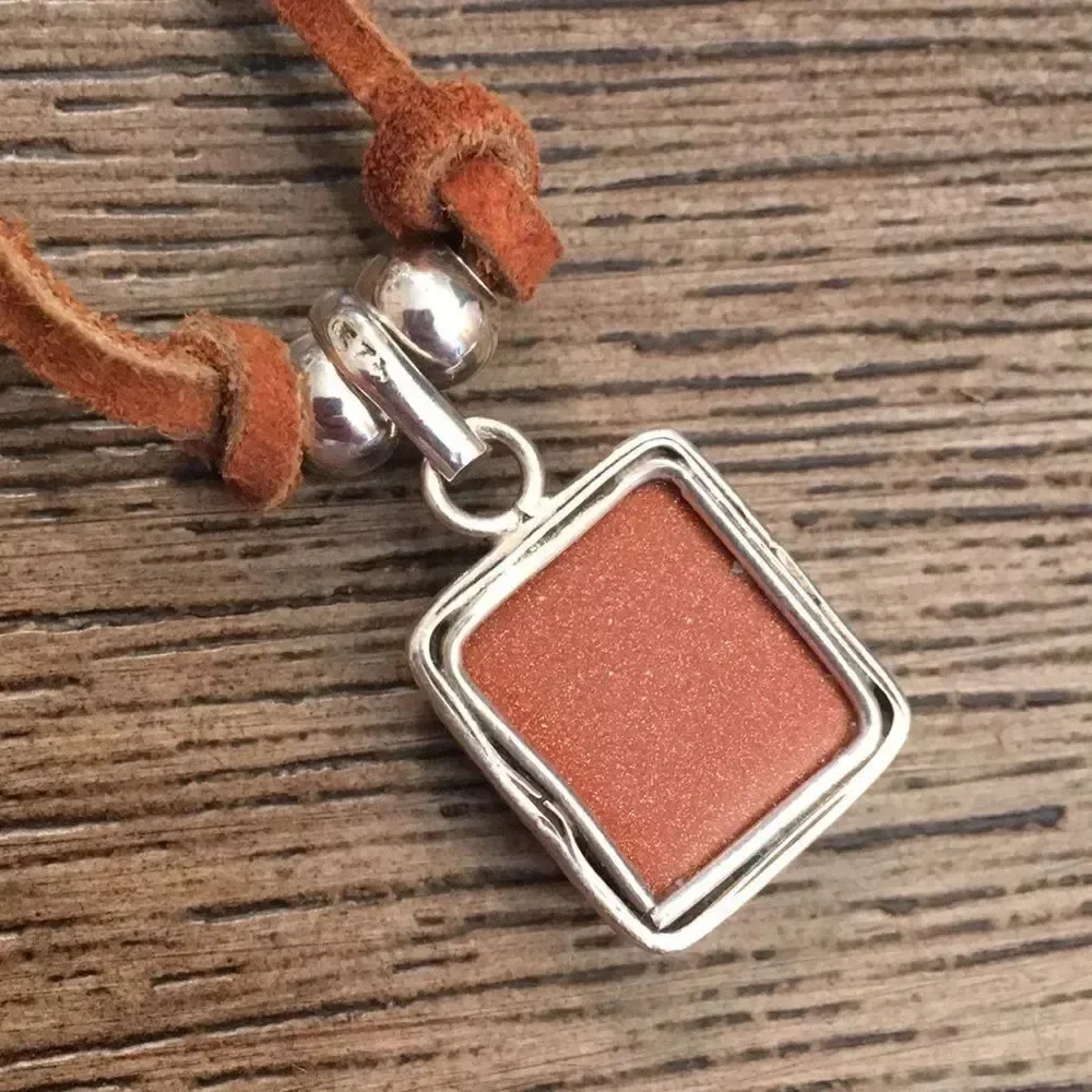 Sterling Silver Goldstone Pendant on Leather Cord